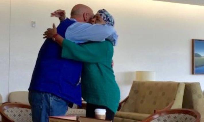 Jim Slaughter hugs pancreatic cancer patient Jean Spencer