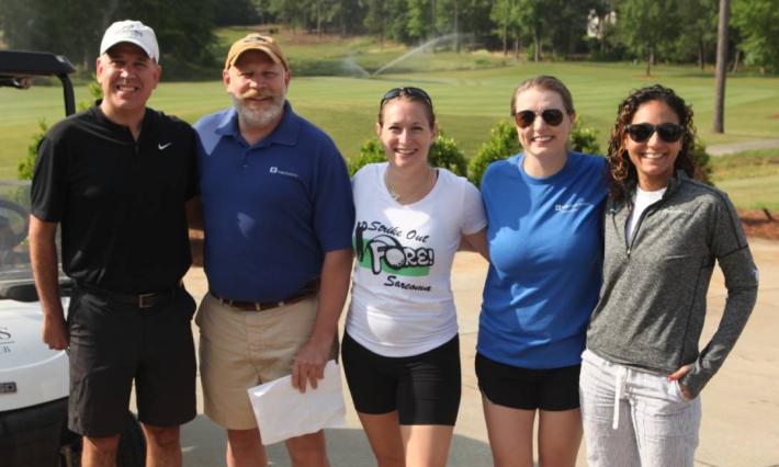 Duke Sarcoma Center doctors and nurses smile for a photo at the 2023 Strike Out Fore Sarcoma golf tournament
