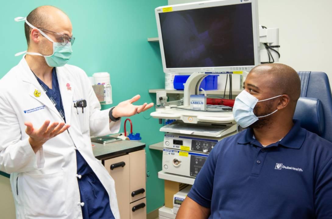 Doctor explains research to patient
