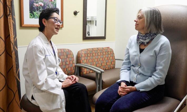 Shelley Hwang speaking with a patient