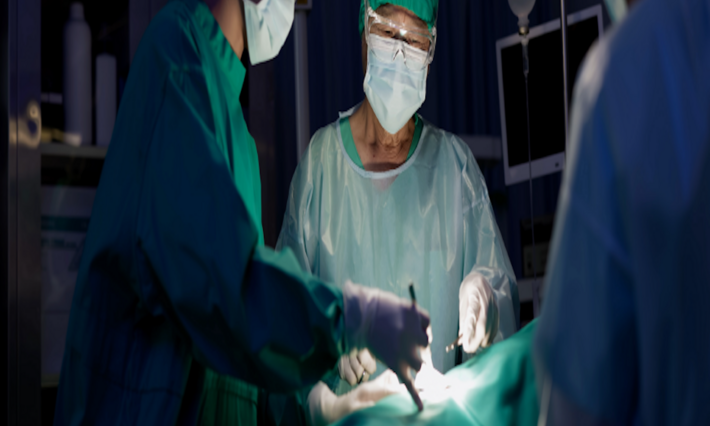 Surgeons in operating room performing a procedure