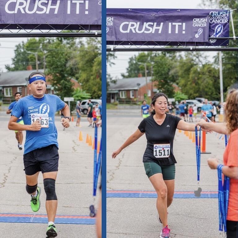 two runners cross a finish line, each under a blue banner that reads Crush It