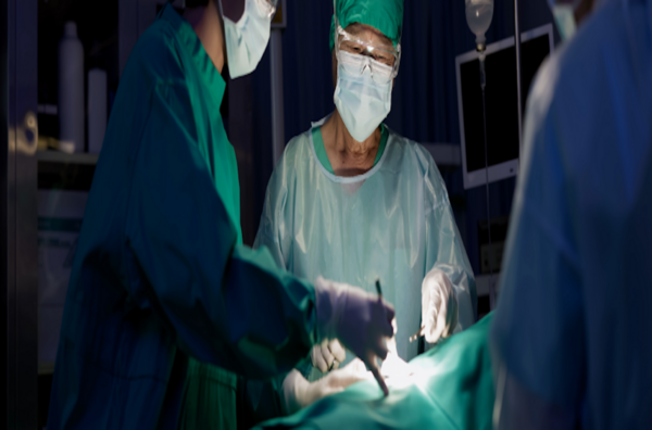 Surgeons in operating room performing a procedure