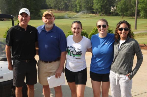 Duke Sarcoma Center doctors and nurses smile for a photo at the 2023 Strike Out Fore Sarcoma golf tournament