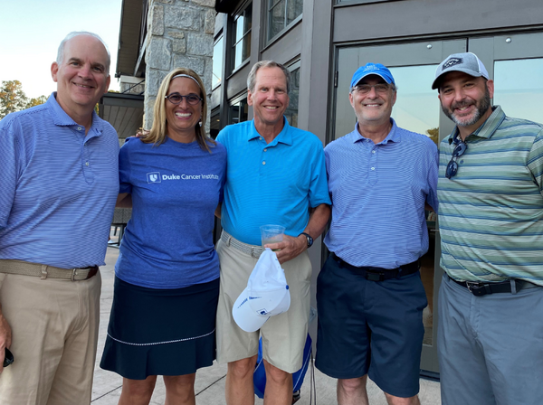 A group of participants smile at the Tee Off Vs. Cancer Event in 2022